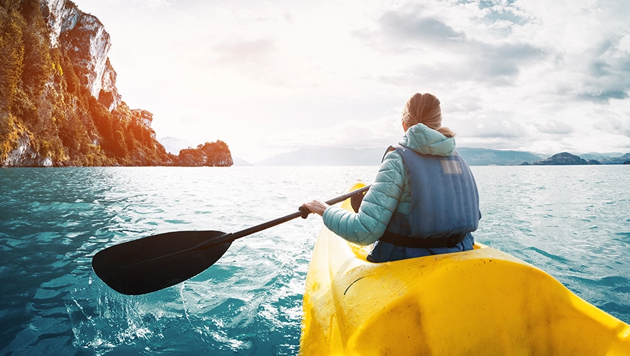 Woman kayaking on General Carrera Lake