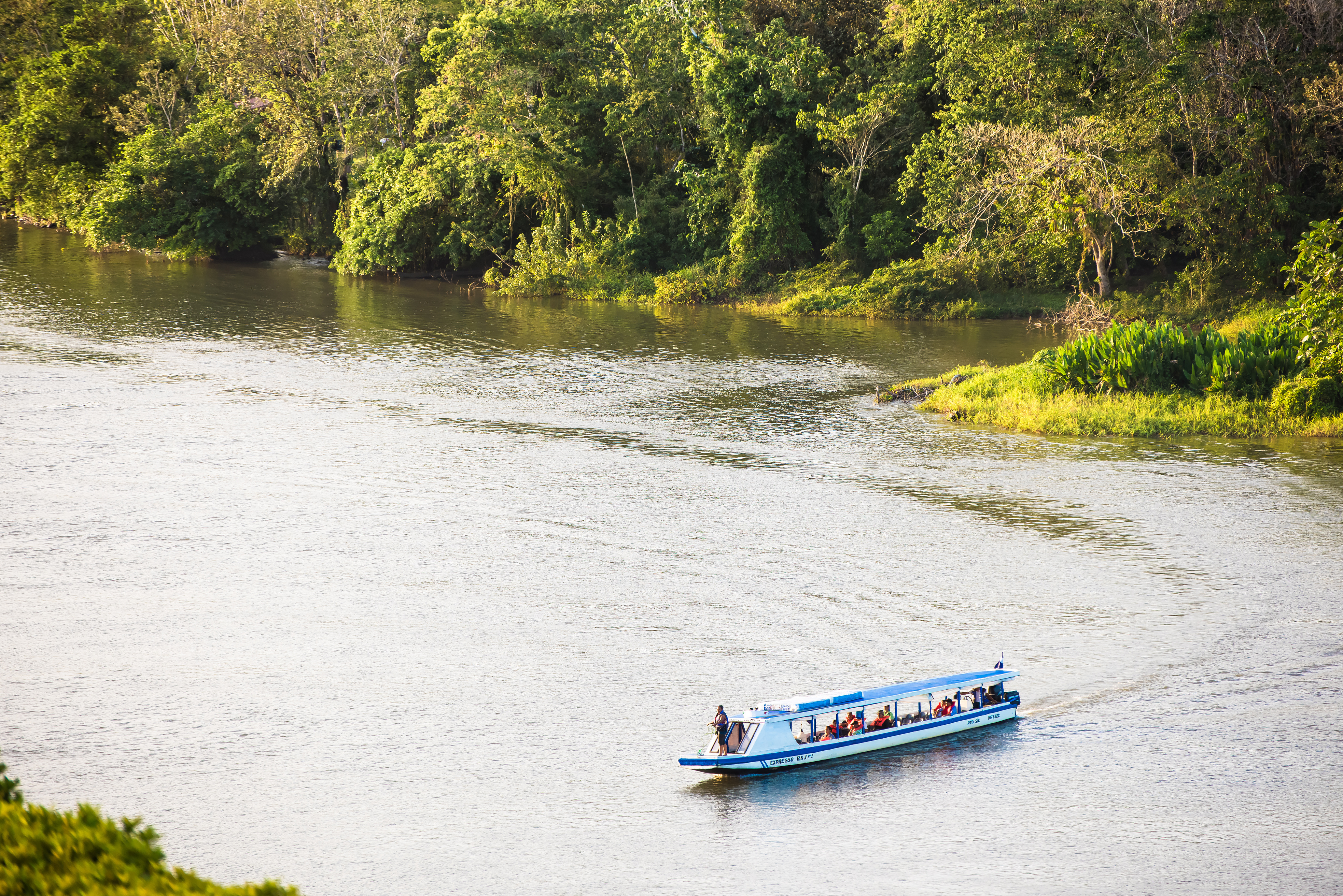 Nicaragua, Little Boat Passing By San Juan River.