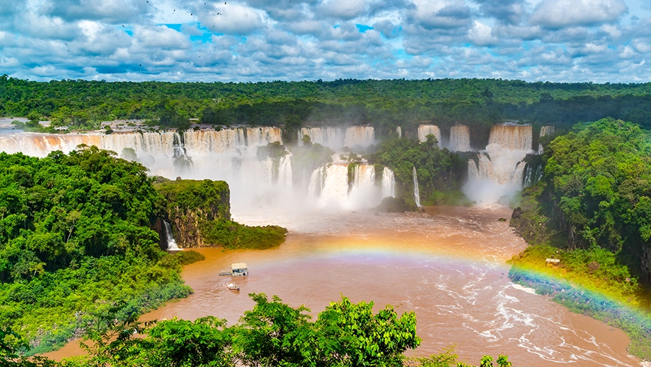 Argentina side of Iguazu Falls with a rainbow