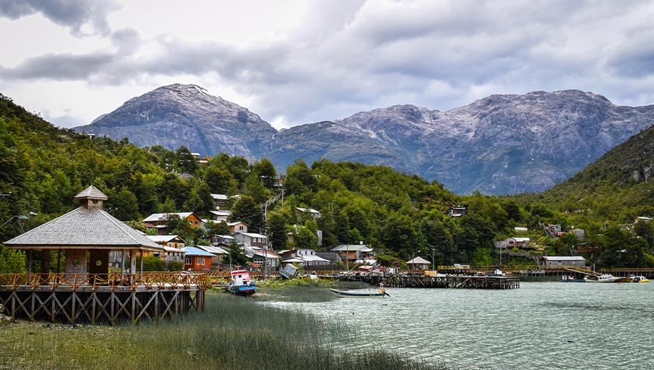 Caleta Tortel with mountains in the background