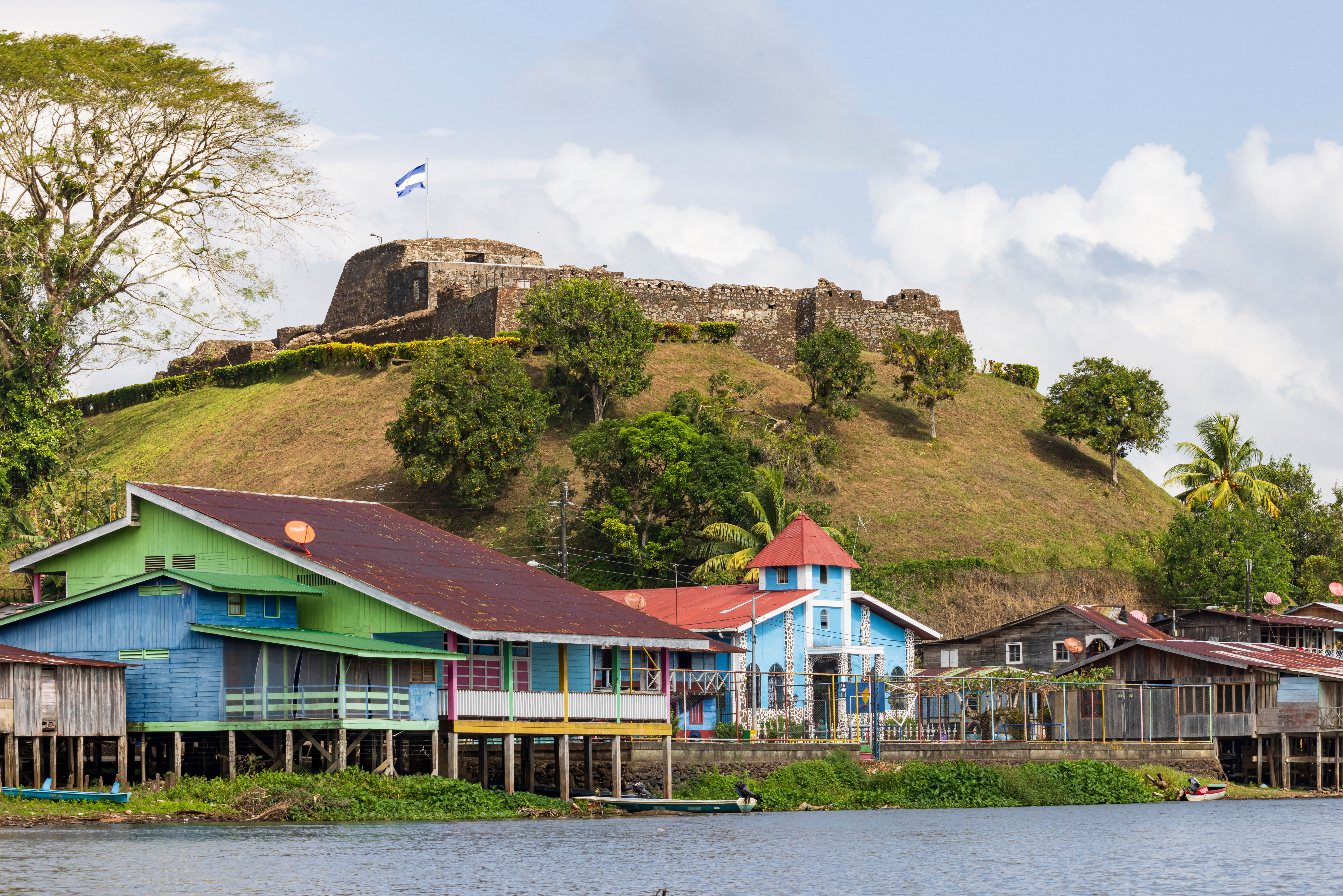 Nicaragua Scenic View Of Colorful Church And Fortress Of El Castillo Village Along The San Juan River In