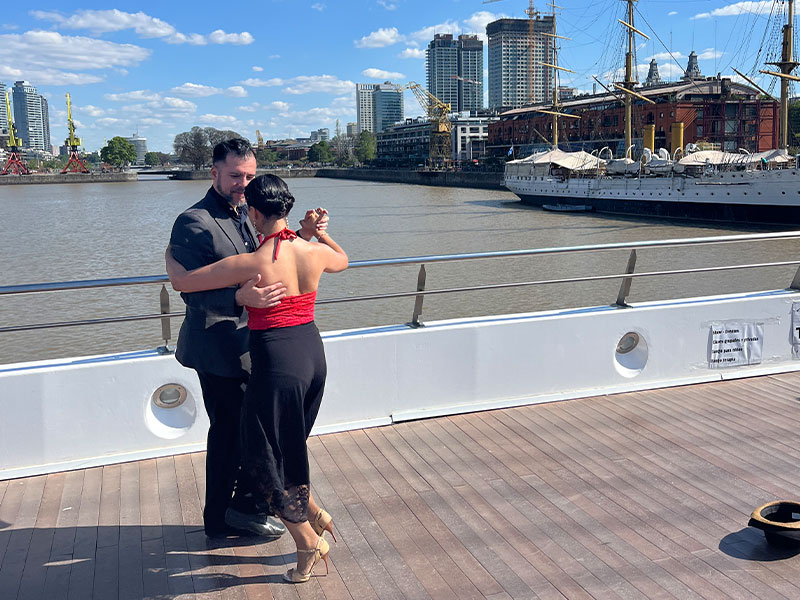 A couple dancing tango on a bridge in Buenos Aires