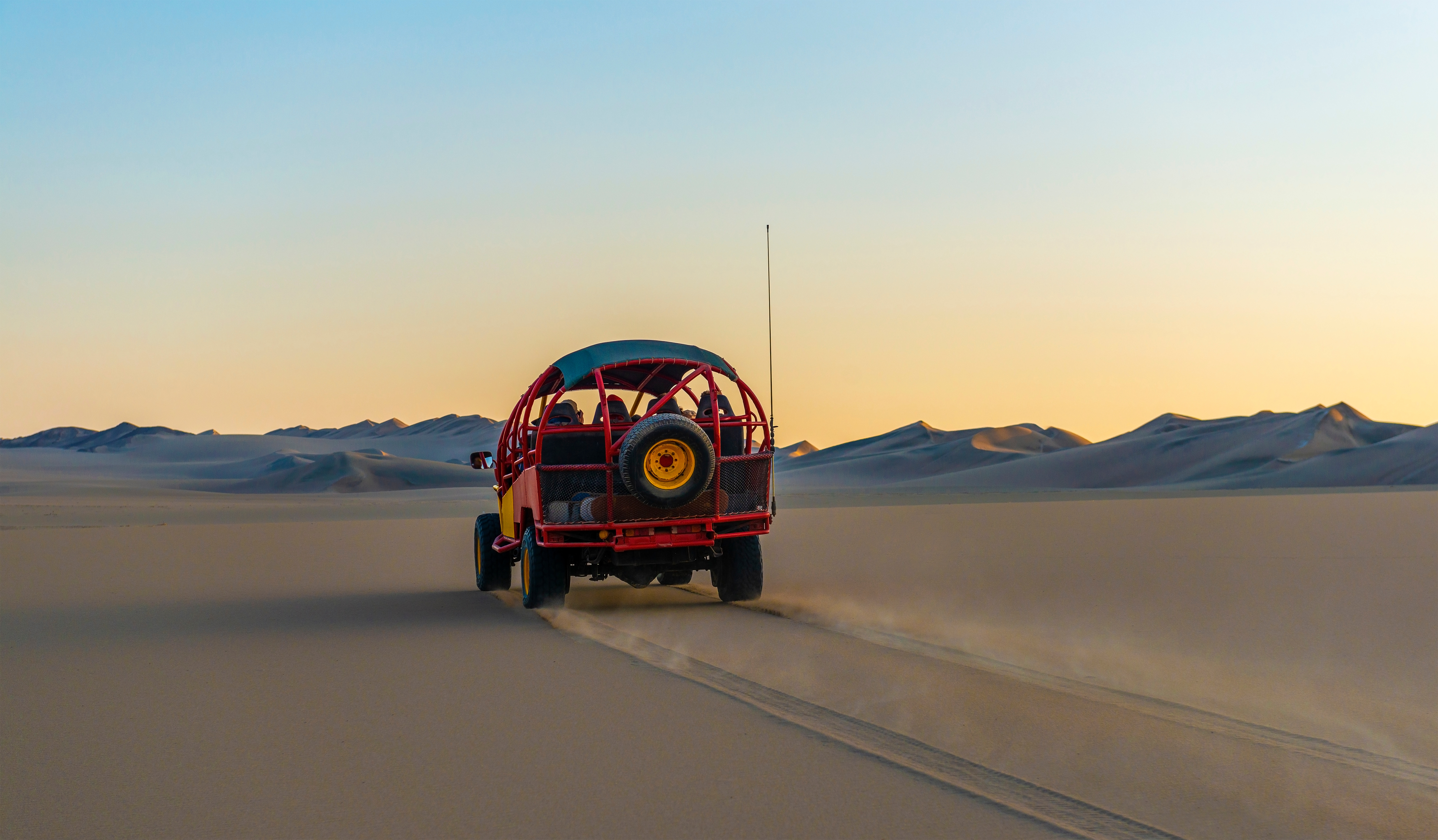 Peru, Desert Buggy Driving Through The Nazca Desert At Sunset Between Ica And Huacachina,