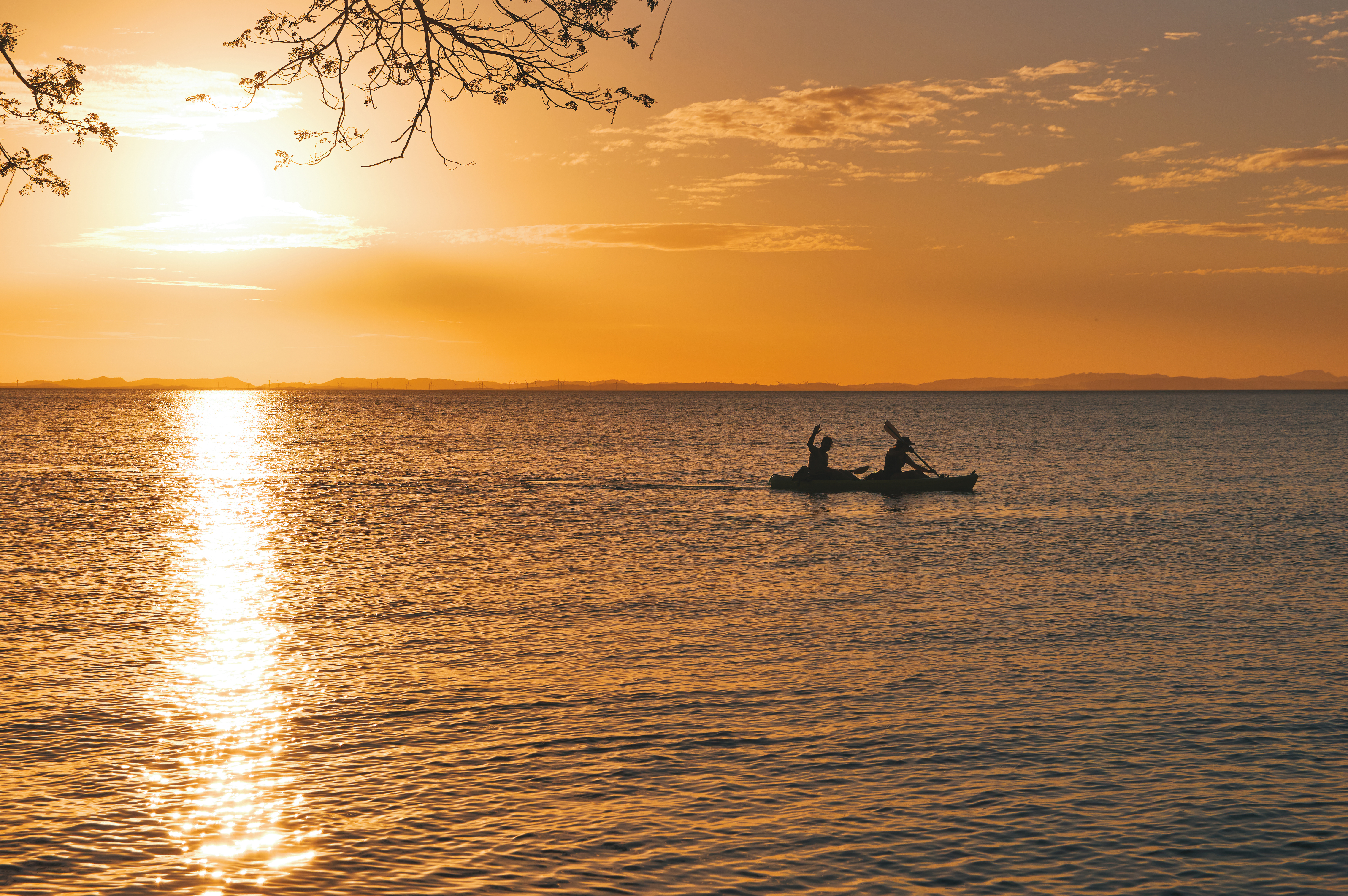 Nicaragua Silhouette Of People Kayaking At Sunset On The Lake At Ometepe Island,